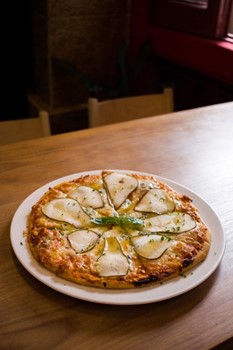 Homemade pizza with mozzarella, apple, blue cheese and honey - Image 1